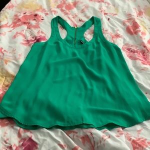 Cute sleeveless green blouse.